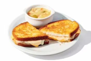 Denny’s 55+ Grilled Cheese Sandwich with melted cheese and a side of soup.