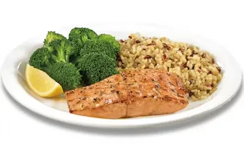 Denny’s 55+ White Alaska Salmon fillet served with broccoli and rice pilaf.