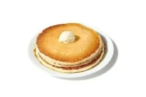 Denny’s add-on stack of pancakes served with butter and syrup.