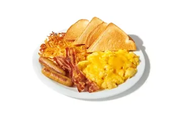 Denny’s All-American Slam with scrambled eggs, bacon, sausage, and golden hash browns.
