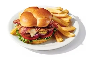 Denny’s BBQ Bacon Chicken Sandwich with grilled chicken, smoky BBQ sauce, melted cheese, and bacon.