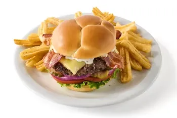 Denny’s Bacon Ranch Cheeseburger with beef patty, melted cheese, ranch sauce, and crispy bacon.
