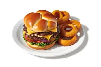 Denny’s Double Cheeseburger with two beef patties, melted cheese, lettuce, tomato, and onion.