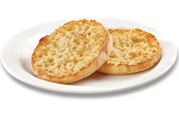 Denny’s toasted English muffin halves served with butter.