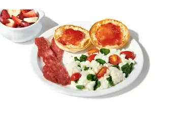Denny’s Fit Slam with scrambled egg whites, turkey bacon, English muffin, and seasonal fruit.