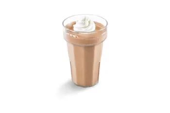 Denny’s Jr. Milk Shake served in a tall glass with creamy whipped topping.