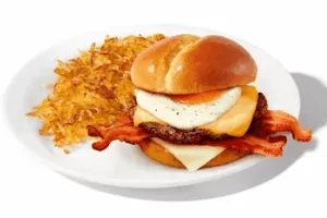 Denny’s Loaded Breakfast Sandwich with eggs, cheese, bacon, and sausage.
