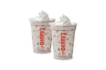 Denny’s Oreo Shake Pack with milkshakes topped with Oreo cookie pieces and whipped cream.