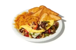 Denny’s Philly Cheesesteak Omelette with steak strips, onions, peppers, and melted cheese.