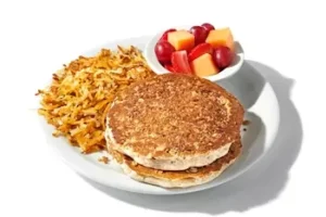 Denny’s Plant-Based Pancake Slam with pancakes, eggs, hash browns, and plant-based sausage.