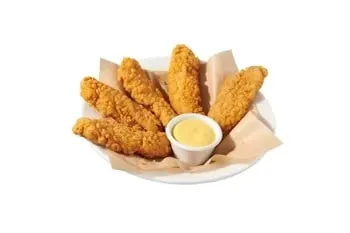 Denny’s Premium Chicken Tenders crispy fried and served with dipping sauce.