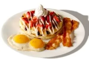 Denny’s Red, White and Berry Everyday Slam with pancakes topped with strawberries, blueberries, and whipped cream.
