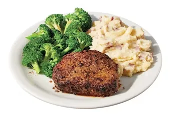 Denny’s Sirloin Steak grilled and served with rice pilaf and steamed broccoli.