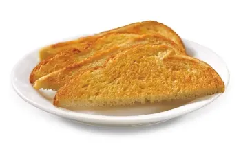 Denny’s golden brown buttered toast slices served on a plate.