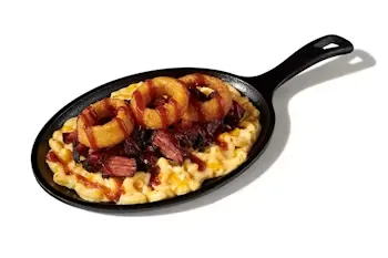 Denny’s Smokehouse Mac & Cheese Skillet baked with cheese, crispy bacon, and seasoned chicken.