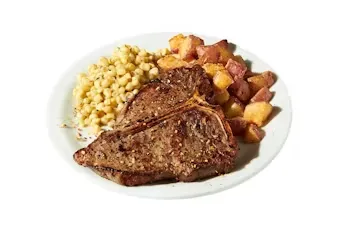 Denny’s T-Bone Steak grilled to order with seasoned potatoes and broccoli.