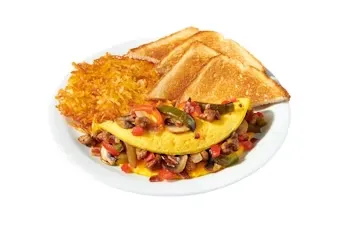 Denny’s Ultimate Omelette loaded with sausage, peppers, onions, mushrooms, cheese, and hash browns on the side.
