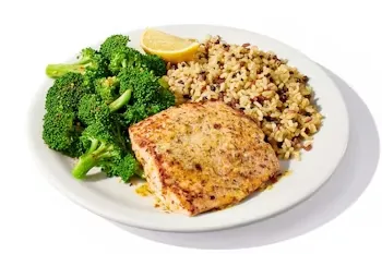 Denny’s Wild Alaska Salmon fillet served with rice and steamed broccoli.